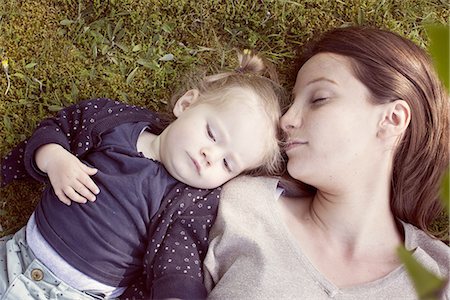 Mother and baby girl napping on grass Stock Photo - Premium Royalty-Free, Code: 632-07849469