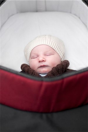 Baby sleeping in pram Stock Photo - Premium Royalty-Free, Code: 632-07849504