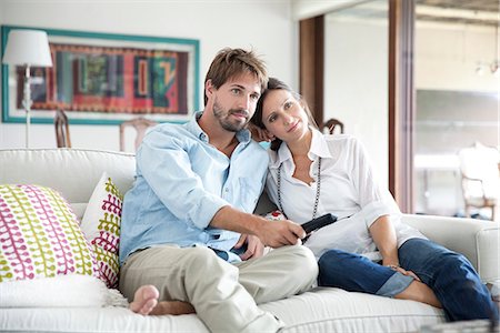 Couple watching TV together Stock Photo - Premium Royalty-Free, Code: 632-07849500