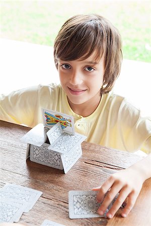 simsearch:632-03424261,k - Boy building house of cards Stock Photo - Premium Royalty-Free, Code: 632-08001844