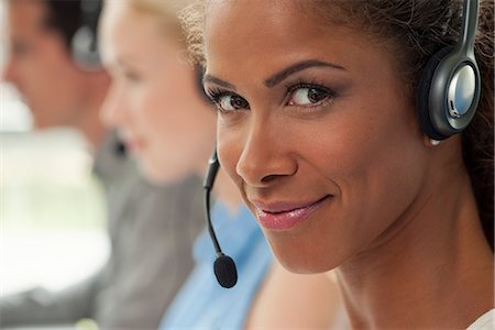 simsearch:6109-06002816,k - Woman working in call center, smiling confidently Stock Photo - Premium Royalty-Free, Code: 632-08001853