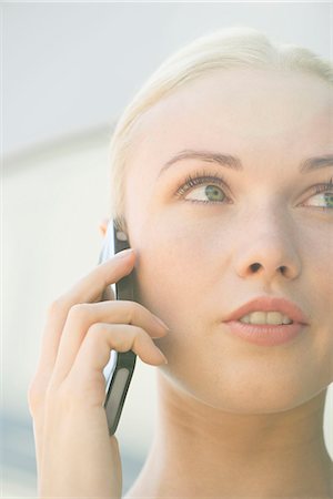 simsearch:632-08130128,k - Woman talking on cell phone with serious expression on face Stock Photo - Premium Royalty-Free, Code: 632-08129724