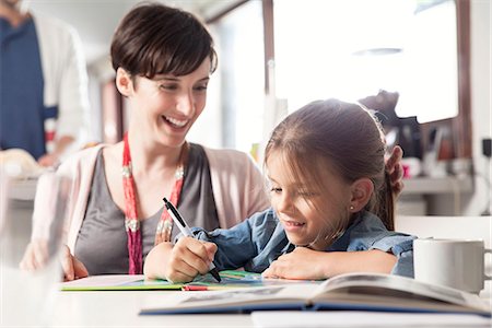 Mother and young daughter reading together Stock Photo - Premium Royalty-Free, Code: 632-08129927