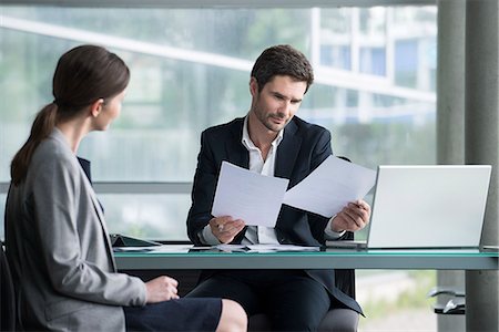 Businessman reviewing documents with client Stock Photo - Premium Royalty-Free, Code: 632-08129932