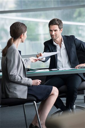 select focus - Businessman handing document to client Stock Photo - Premium Royalty-Free, Code: 632-08129933