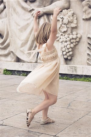 Little girl dancing outdoors Stock Photo - Premium Royalty-Free, Code: 632-08130279