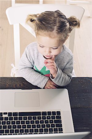 simsearch:614-06897440,k - Little girl looking at laptop computer Stock Photo - Premium Royalty-Free, Code: 632-08227466