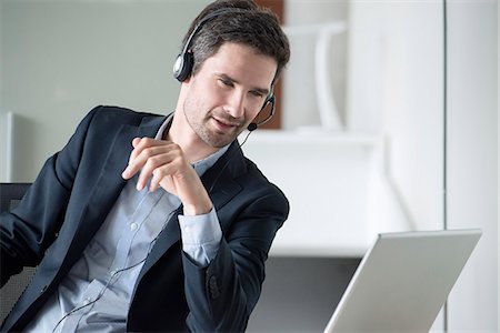 switchboard operator - Telemarketer making pitch Stock Photo - Premium Royalty-Free, Code: 632-08227631