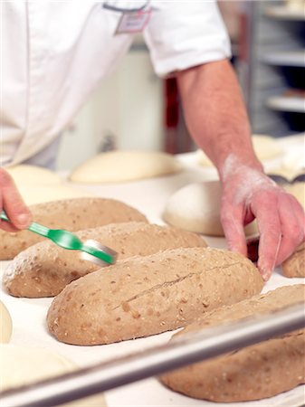 simsearch:649-06165027,k - Baker scoring bread dough, cropped Stock Photo - Premium Royalty-Free, Code: 632-08227766