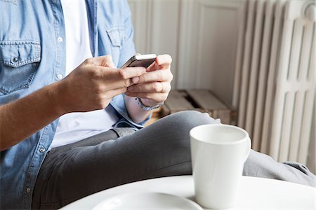 radiator (heater) - Man catching up with emails while having morning coffee Stock Photo - Premium Royalty-Free, Code: 632-08227789