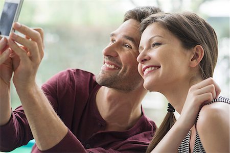 simsearch:632-07674444,k - Couple posing for a selfie with a smartphone Stock Photo - Premium Royalty-Free, Code: 632-08331473