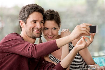 simsearch:632-07674444,k - Couple taking selfie with smartphone Stock Photo - Premium Royalty-Free, Code: 632-08331572