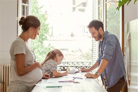 felt tip pen - Parents watching as daughter colors Stock Photo - Premium Royalty-Free, Code: 632-08545857