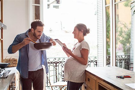 pregnant cooking - Husband and wife cooking at home Stock Photo - Premium Royalty-Free, Code: 632-08545904