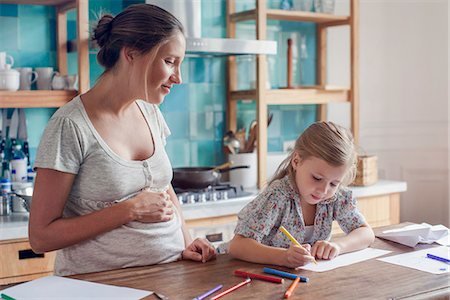 felt tip pen - Pregnant mother watching daughter draw Stock Photo - Premium Royalty-Free, Code: 632-08545936