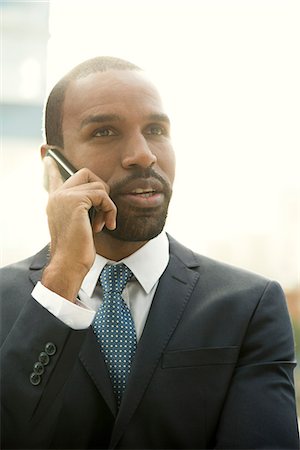 simsearch:632-05400935,k - Businessman talking on cell phone Stock Photo - Premium Royalty-Free, Code: 632-08698361