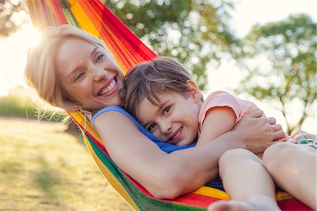 simsearch:632-05816381,k - Mother and son embracing in hammock, portrait Stock Photo - Premium Royalty-Free, Code: 632-08698456