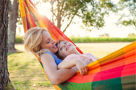 simsearch:632-05816381,k - Mother and son relaxing in hammock together Stock Photo - Premium Royalty-Free, Code: 632-08698450