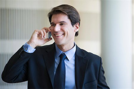 simsearch:632-05400935,k - Businessman talking on cell phone Stock Photo - Premium Royalty-Free, Code: 632-08698471