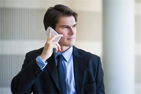 simsearch:6109-06685044,k - Businessman listening to voicemail on cell phone Stock Photo - Premium Royalty-Free, Code: 632-08698473