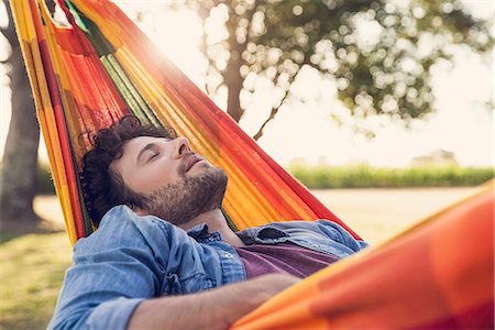 Man napping in hammock Stock Photo - Premium Royalty-Free, Code: 632-08698571