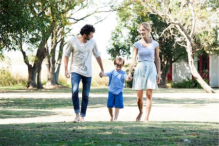 Family with one child taking walk outdoors together Stock Photo - Premium Royalty-Free, Code: 632-08698587