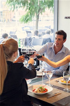 simsearch:632-01150248,k - Friends clinking wine glasses in restaurant Foto de stock - Sin royalties Premium, Código: 632-08886360