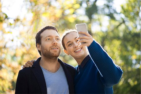 simsearch:632-07674444,k - Couple taking selfie in woods Stock Photo - Premium Royalty-Free, Code: 632-08886450