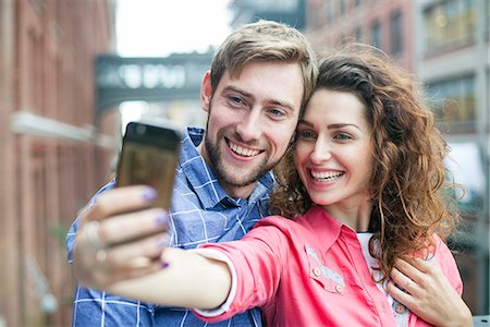 simsearch:632-07674444,k - Couple taking a selfie together outdoors Stock Photo - Premium Royalty-Free, Code: 632-08886720