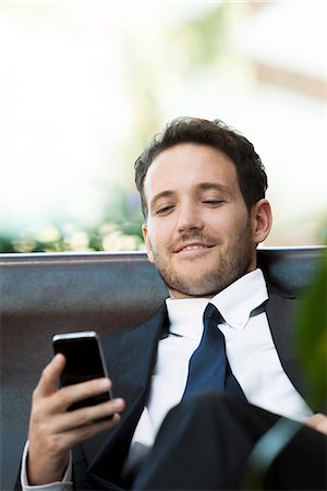 simsearch:632-03403433,k - Business executive using smartphone Stock Photo - Premium Royalty-Free, Code: 632-08886795