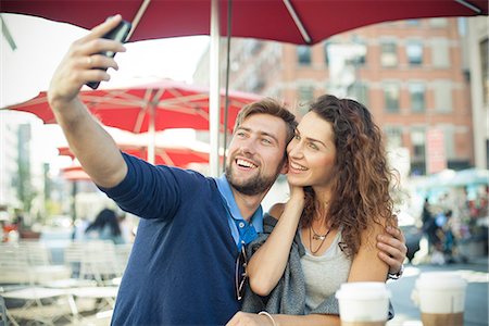 simsearch:632-07674444,k - Couple posing for a selfie at outdoor cafe Stock Photo - Premium Royalty-Free, Code: 632-08886988