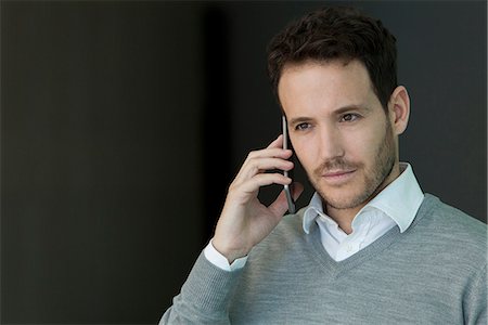 simsearch:632-05400935,k - Businessman talking on cell phone Stock Photo - Premium Royalty-Free, Code: 632-08887013