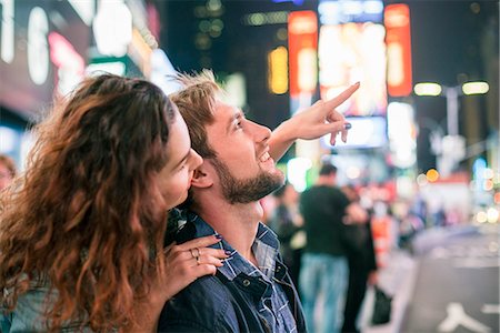 Young couple sightseeing in Times Square, New York City, New York, USA Stock Photo - Premium Royalty-Free, Code: 632-08887101