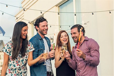 simsearch:6113-06909171,k - Friends drinking champagne together outdoors Stock Photo - Premium Royalty-Free, Code: 632-08993466