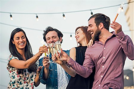 simsearch:6113-06909171,k - Friends clinking champagne glasses outdoors Stock Photo - Premium Royalty-Free, Code: 632-08993468