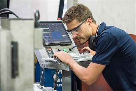 Machinist working in factory Stock Photo - Premium Royalty-Free, Code: 632-08993647