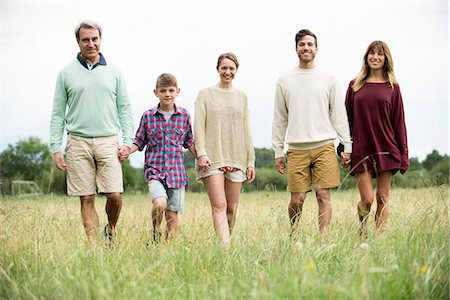 simsearch:6113-08393683,k - Family walking together through meadow Stock Photo - Premium Royalty-Free, Code: 632-09021388