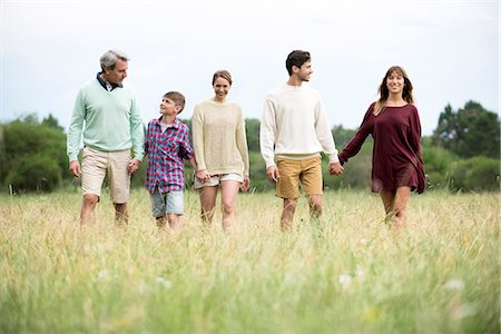 simsearch:6113-08393683,k - Family walking together in field Stock Photo - Premium Royalty-Free, Code: 632-09021389