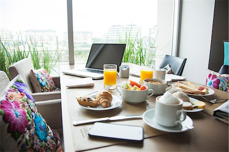 selective focus computer no people - Breakfast and laptop computer on table Stock Photo - Premium Royalty-Free, Code: 632-09021483