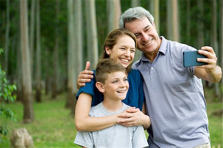 Family posing for selfie Stock Photo - Premium Royalty-Free, Code: 632-09021608