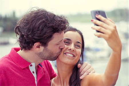 simsearch:632-07674444,k - Man and woman posing for selfie taken with smart phone Stock Photo - Premium Royalty-Free, Code: 632-09039694