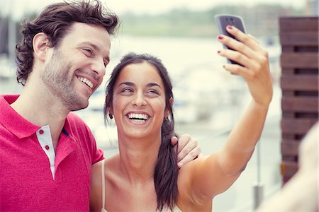 simsearch:632-07674444,k - Man and woman posing for selfie taken with smart phone Stock Photo - Premium Royalty-Free, Code: 632-09039693