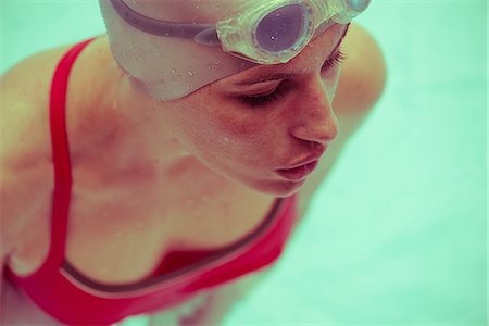simsearch:632-05760692,k - Woman swimming in pool, close-up Stock Photo - Premium Royalty-Free, Code: 632-09140311