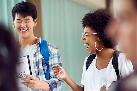 picture of people walking and chatting - Students laughing together in corridor Stock Photo - Premium Royalty-Free, Code: 632-09157997