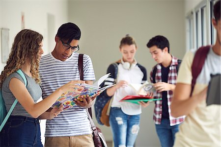 simsearch:614-06973669,k - Students studying together in corridor Stock Photo - Premium Royalty-Free, Code: 632-09158076