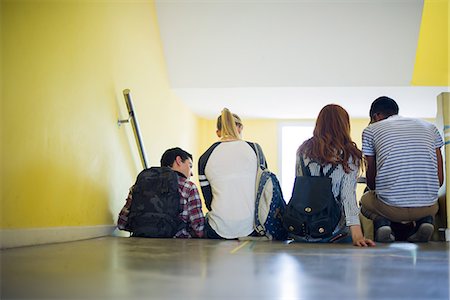 simsearch:614-06973669,k - Students sitting together in stairwell, rear view Stock Photo - Premium Royalty-Free, Code: 632-09158089