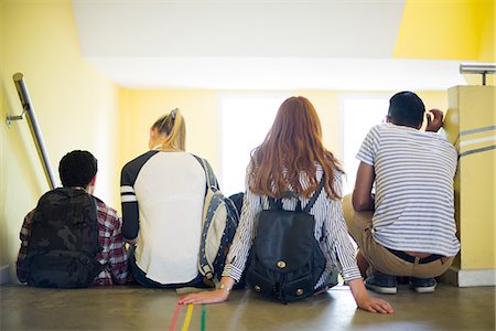 simsearch:614-06973669,k - Students sitting together in stairwell, rear view Stock Photo - Premium Royalty-Free, Code: 632-09158090