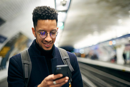 portable phone - Smiling businessman using smartphone Stock Photo - Premium Royalty-Free, Code: 632-09192312