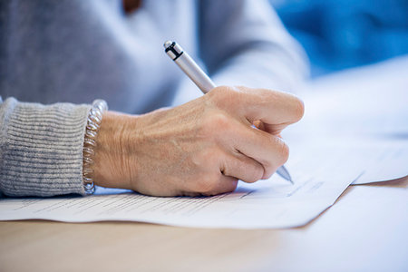 pen (writing instrument) - Close-up of businesswoman signing document Stock Photo - Premium Royalty-Free, Code: 632-09192345