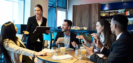 Waitress taking orders from business people in bar Stock Photo - Premium Royalty-Free, Code: 632-09254587